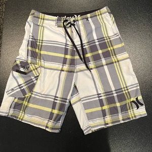 Hurley Board Shorts. Size 30. Plaid with white,  gray and yellow.